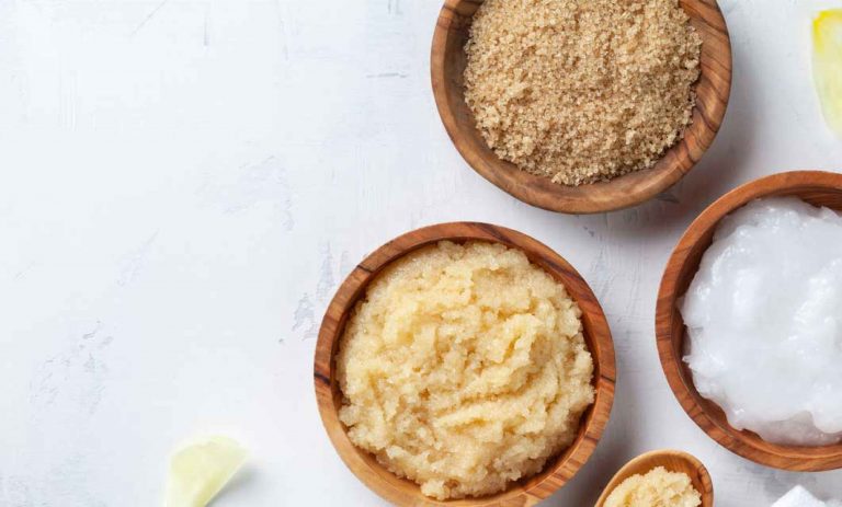 Three Bowls containing ingredients for a sugar scrub