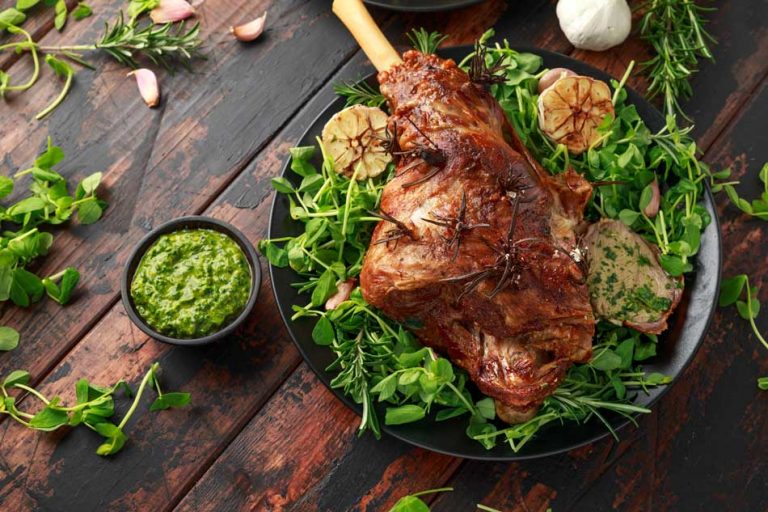 Roated leg of lamb on bed of greens