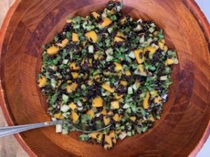 image of mango and black rice salad on a woodeen bowl