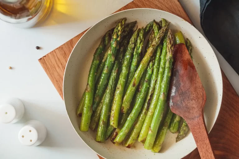 roasted asparagus n a white plate
