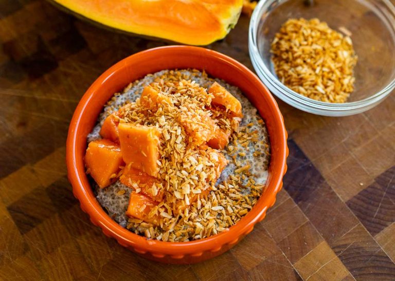 A bowl of chia pudding topped with fresh fruit.