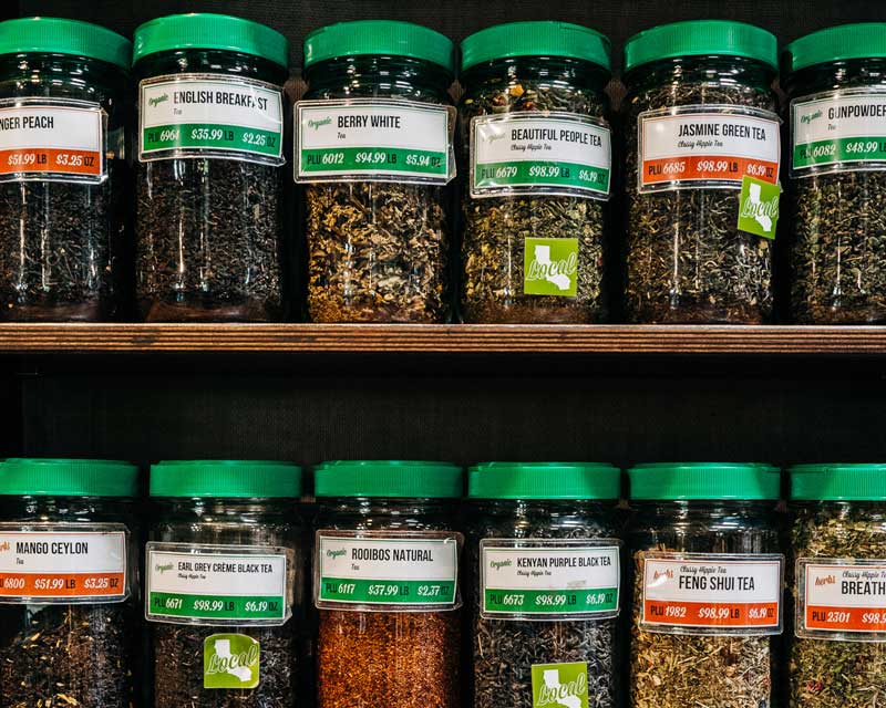 Close up bulk herbs and spice jars