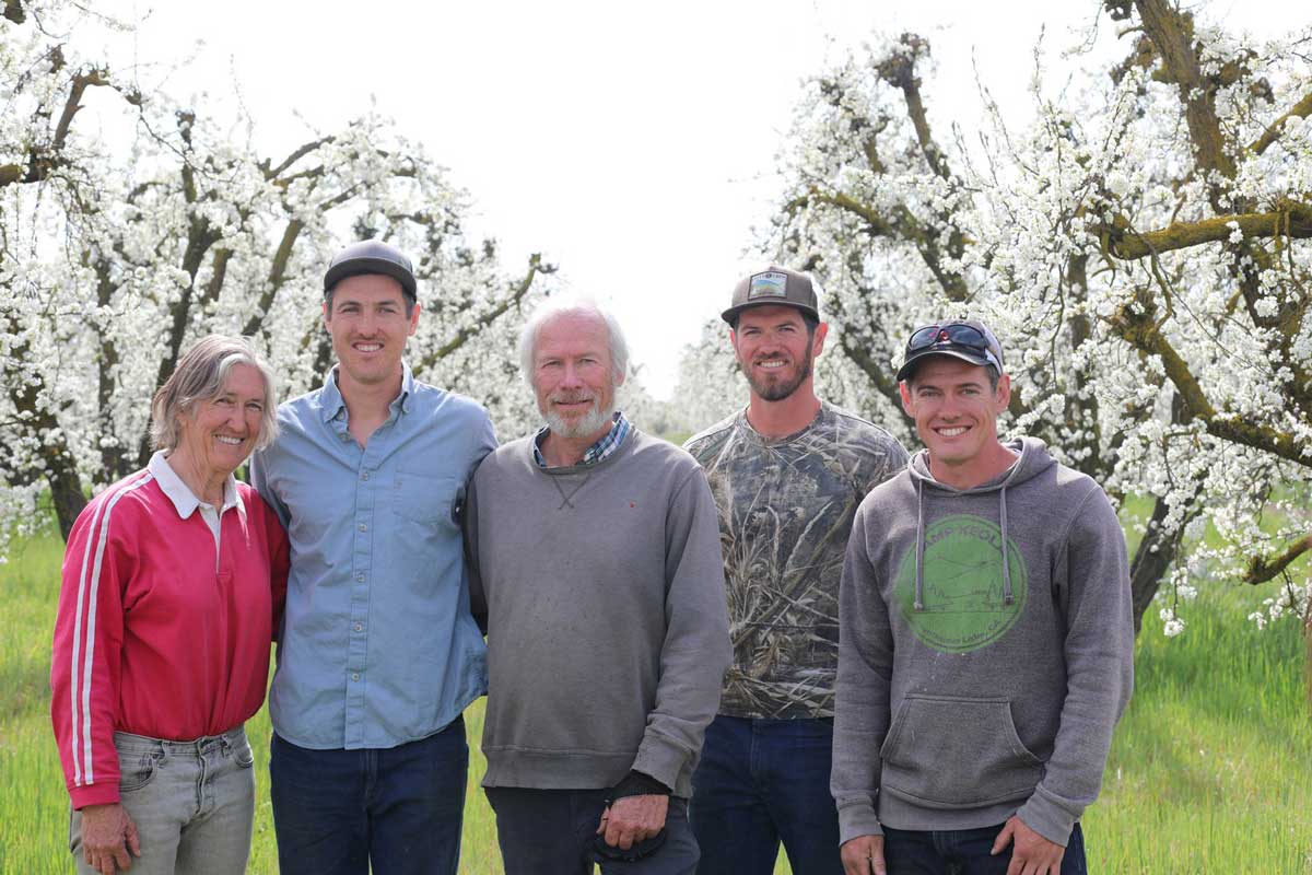 The D.E. boldt family smiling in a group photo on the farm.