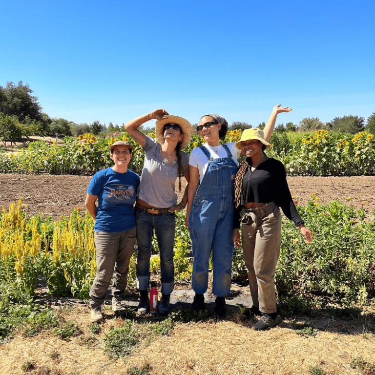 Co-op employees posing for a photo at Soil Born Farm