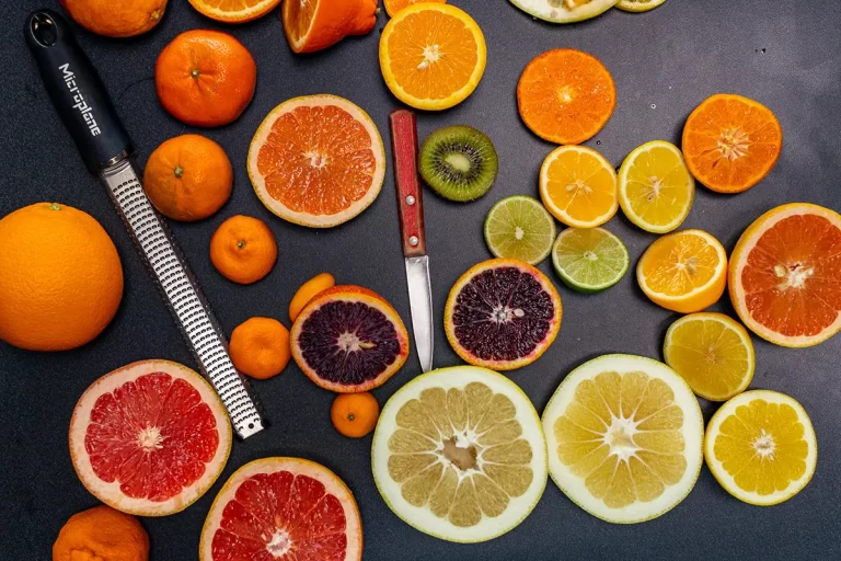 A variety of colorful citrus sliced into wheels.