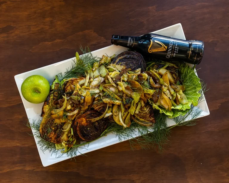 Sauteed cabbage and apples with a bottle of Guiness.