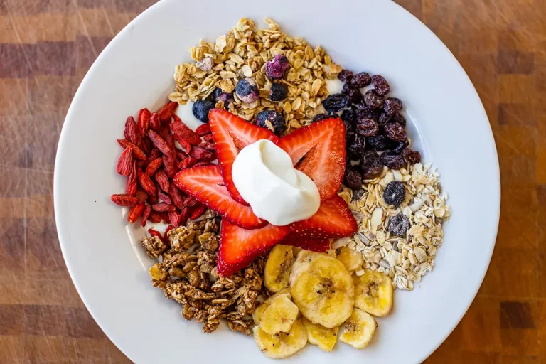 A bowl with fresh fruits and granola.