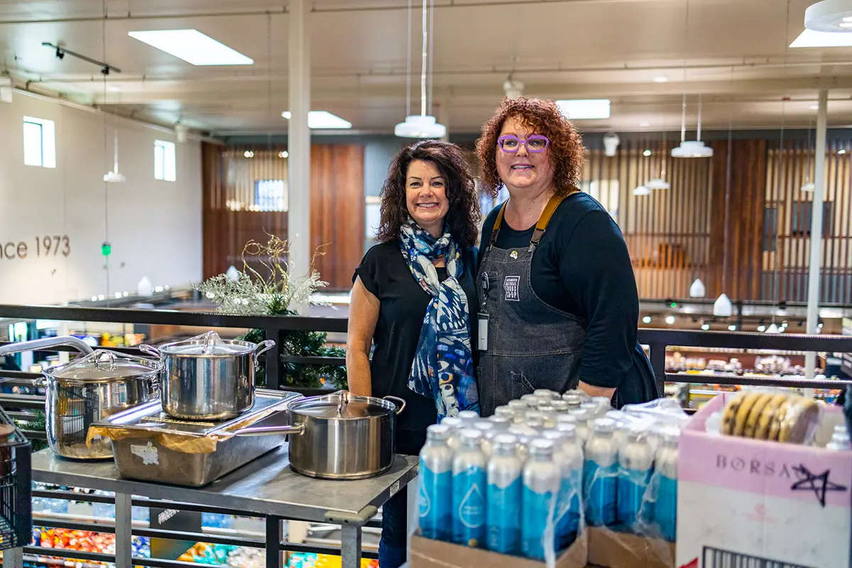 Linda Draffin (left) and Co-op Outreach Coordinator Lori Friedli (right) during a food donation.