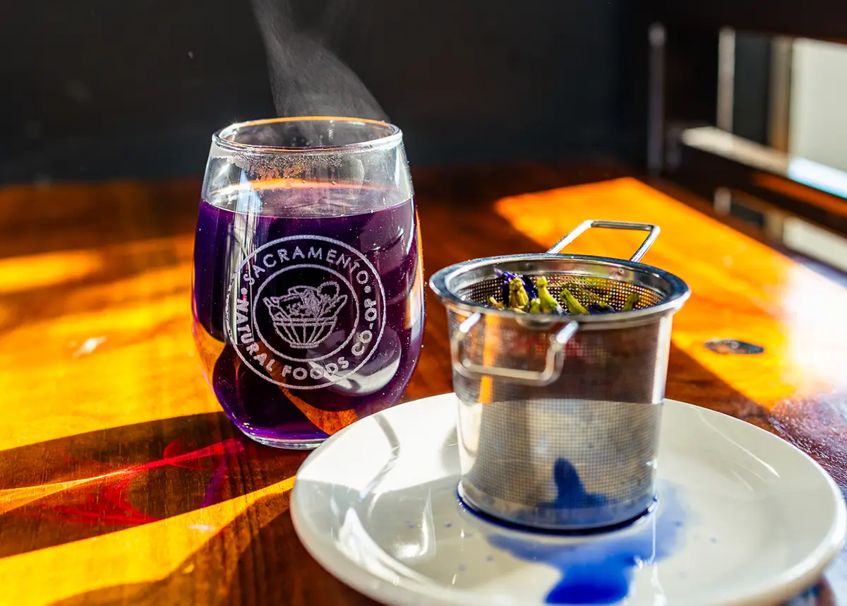 A hot steamy cup of butterfly pea flower tea.